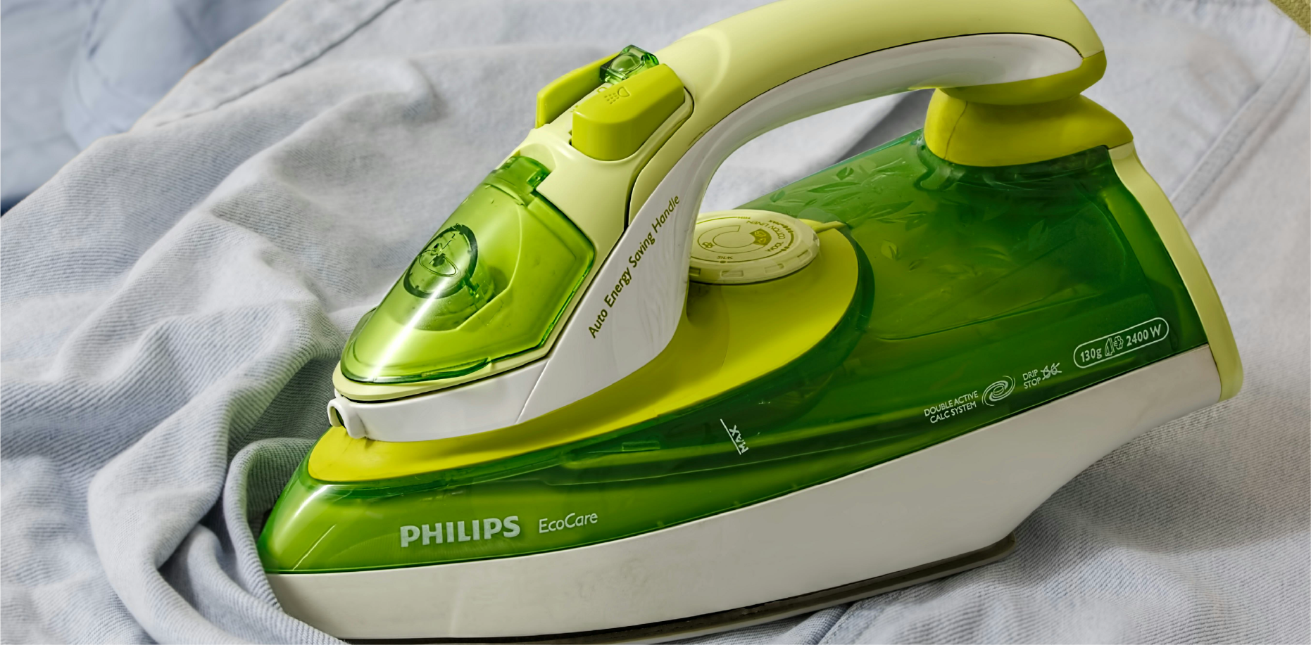 The glossy and matte surface finishes on a modern Philips steam iron, achieved through precision plastic injection molding for aesthetic appeal.