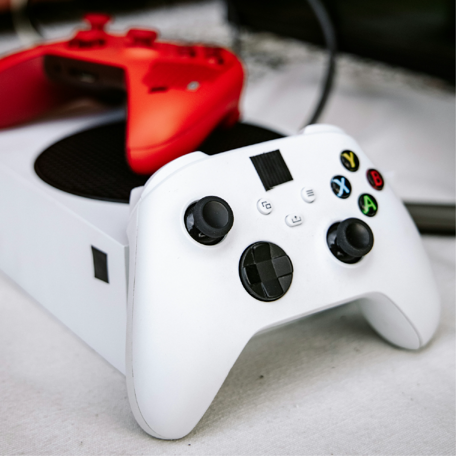 Modern fly-by-wire controls and drone piloting systems in aerospace often use ergonomic interfaces inspired by consumer electronics like these game controllers.
