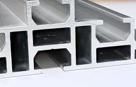 The cross-section of a custom-designed extruded aluminum beam, illustrating a constant profile shape with multiple hollow chambers.