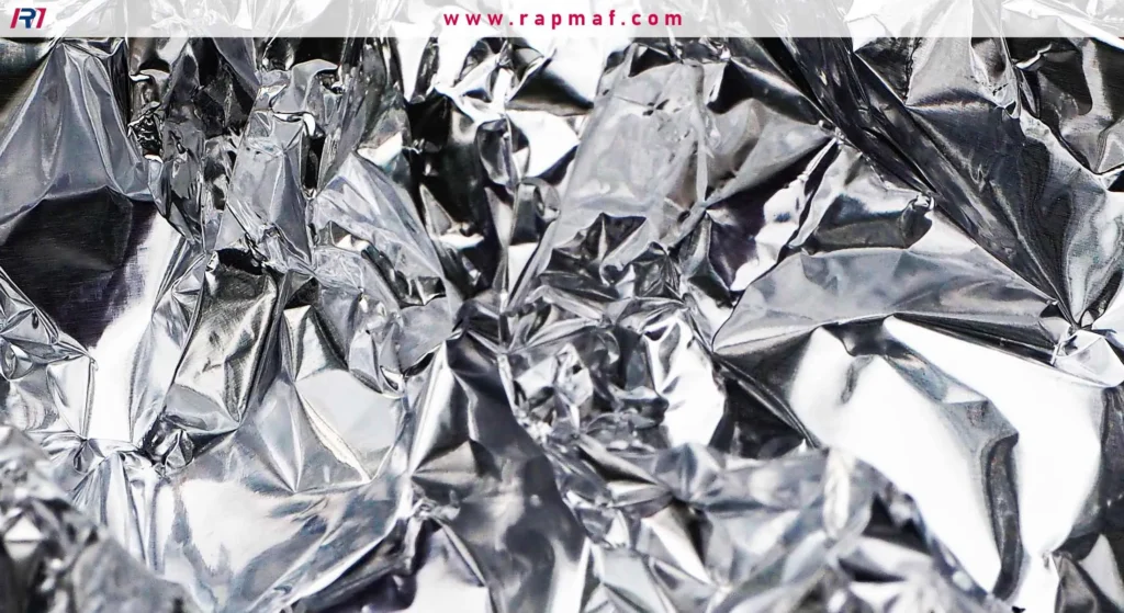 This is a close-up of a common form of aluminum: foil. It represents aluminum in its solid, everyday state, before it undergoes the melting process.