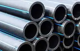 A close-up of neatly stacked black HDPE (High-Density Polyethylene) pipes, each featuring parallel thin blue stripes, commonly used for water transportation.