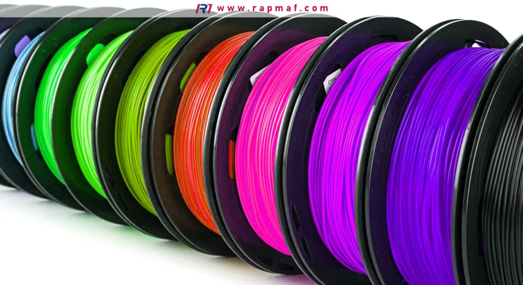 Multiple spools of thermoplastic filament for Fused Deposition Modeling (FDM), showcasing the wide range of colors available for prototyping and production parts.