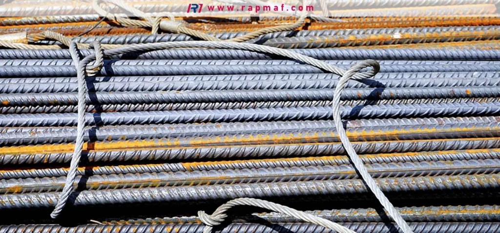 A close-up of bundled steel rebar for construction, showing the ribbed texture designed to bond with concrete. This represents a typical application for low-carbon steel where high tensile strength is prioritized over corrosion resistance.