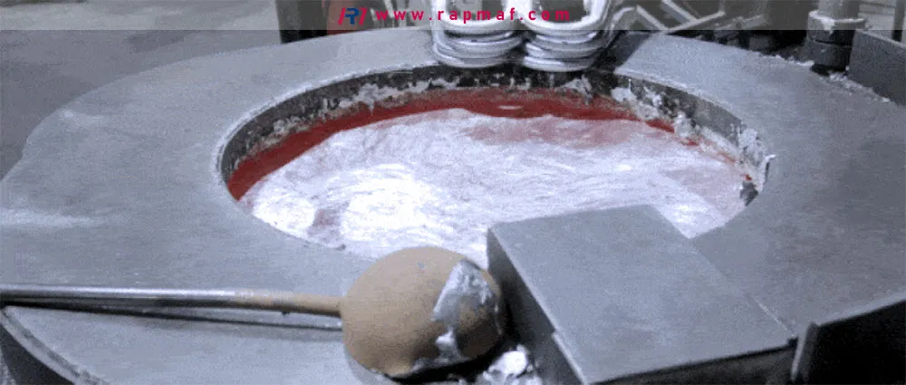 An industrial smelting pot containing liquid molten aluminum, with a large ladle nearby, illustrating a key stage in the aluminum recycling or casting workflow.