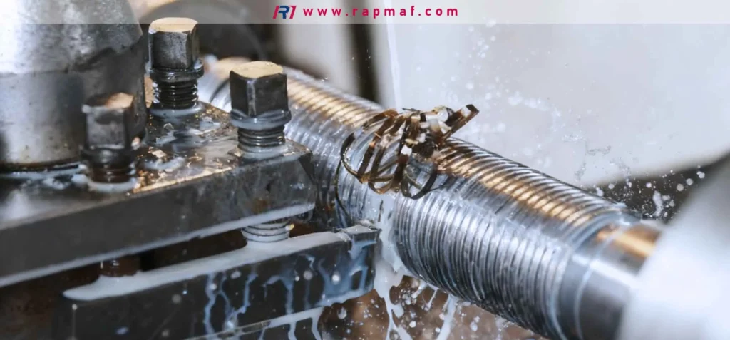 The process of cut knurling on a metal lathe, where sharp cutting wheels remove material to create a precise knurled texture, generating swarf and requiring the application of coolant.