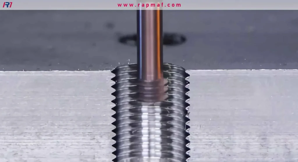 A macro shot showing the creation of flawless internal threads inside a workpiece using a CNC machining process, where each thread is formed with high precision.