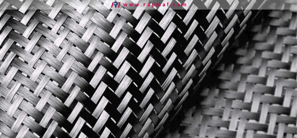 A close-up of the plain weave pattern of a carbon fiber composite sheet. The orientation of these strong fibers provides extreme rigidity and tensile strength to the polymer matrix, making it a top choice for demanding engineering applications.