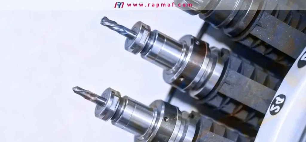 Two CNC tool holders fitted with tungsten carbide twist drills. The image illustrates a core application of tungsten in the form of a cermet (ceramic-metal composite) for creating wear-resistant cutting tools used in manufacturing.