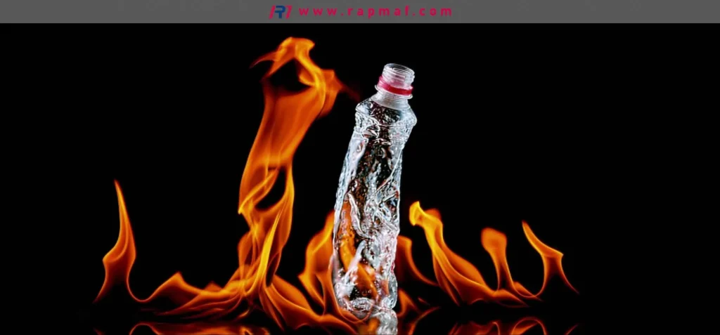 A Rapmaf conceptual image showing a PET plastic bottle surrounded by flames, symbolizing thermal degradation. This illustrates the potential for Polyethylene Terephthalate to melt, deform, and release potentially harmful compounds when exposed to extreme heat or fire.