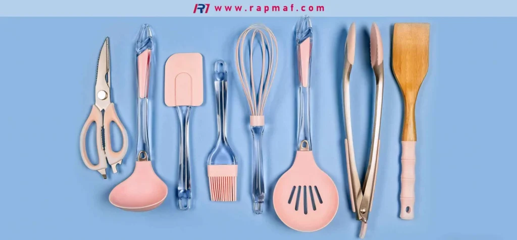 A collection of modern kitchen utensils from Rapmaf, showcasing the wide variety of polymers used in consumer products. The tools feature pink, flexible silicone heads and rigid, clear plastic handles, demonstrating different properties like flexibility, rigidity, and color.