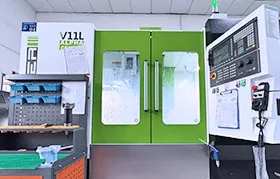 A modern, high-performance V11L Alpha Center CNC machine in the Rapmaf workshop, ready for production. This machine represents the advanced technology used to manufacture the high-precision structural components, or "bones," for AI-powered humanoid robots.