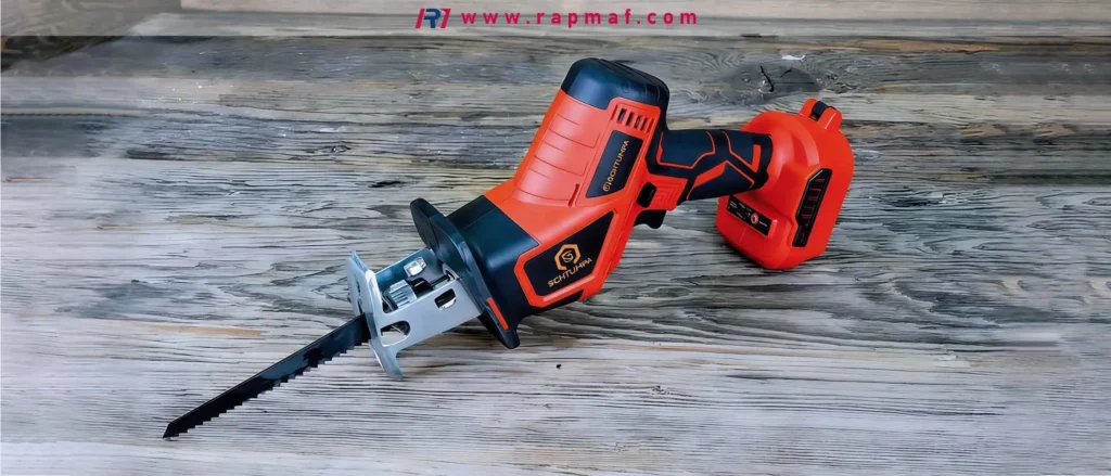A powerful, cordless reciprocating saw with a metal-cutting blade attached, a tool ranked by Rapmaf for its high-speed demolition capabilities. The saw is resting on a rustic wooden surface.