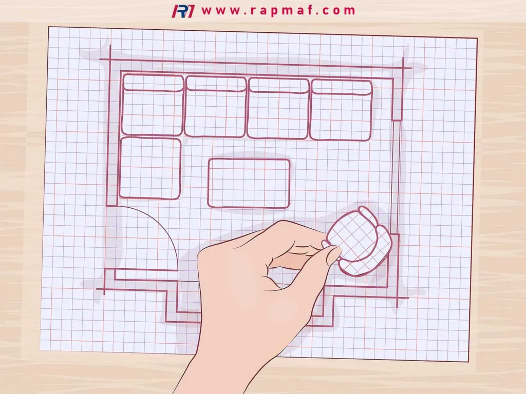 An illustration of a hand arranging furniture on a floor plan, used in Rapmaf's guide as a metaphor for the meticulous planning and organization required in aerospace manufacturing. Just like every piece of furniture has a place, every component and process must be perfectly planned for effective traceability.