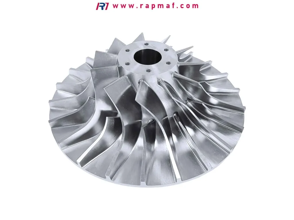 An angled view of a precision-machined aluminum impeller by Rapmaf, highlighting the smooth, contoured surfaces and sharp edges of the blades created through advanced 5-axis CNC milling.