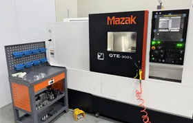 The Mazak QTE-300L CNC turning center in the Rapmaf workshop, a key piece of equipment used for the high-precision manufacturing of parts like impeller hubs and other complex components.