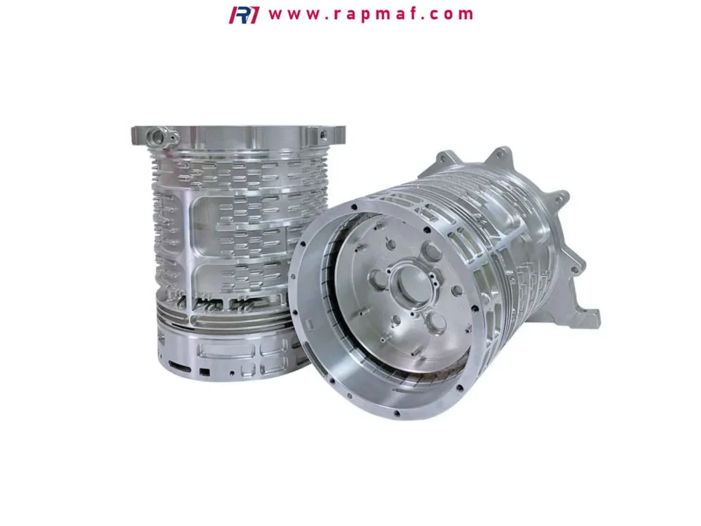 Two examples of large, complex aluminum components CNC machined by Rapmaf, such as motor housings or heat exchangers, showcasing intricate features and demonstrating the company's capability to produce a wide range of high-precision parts.