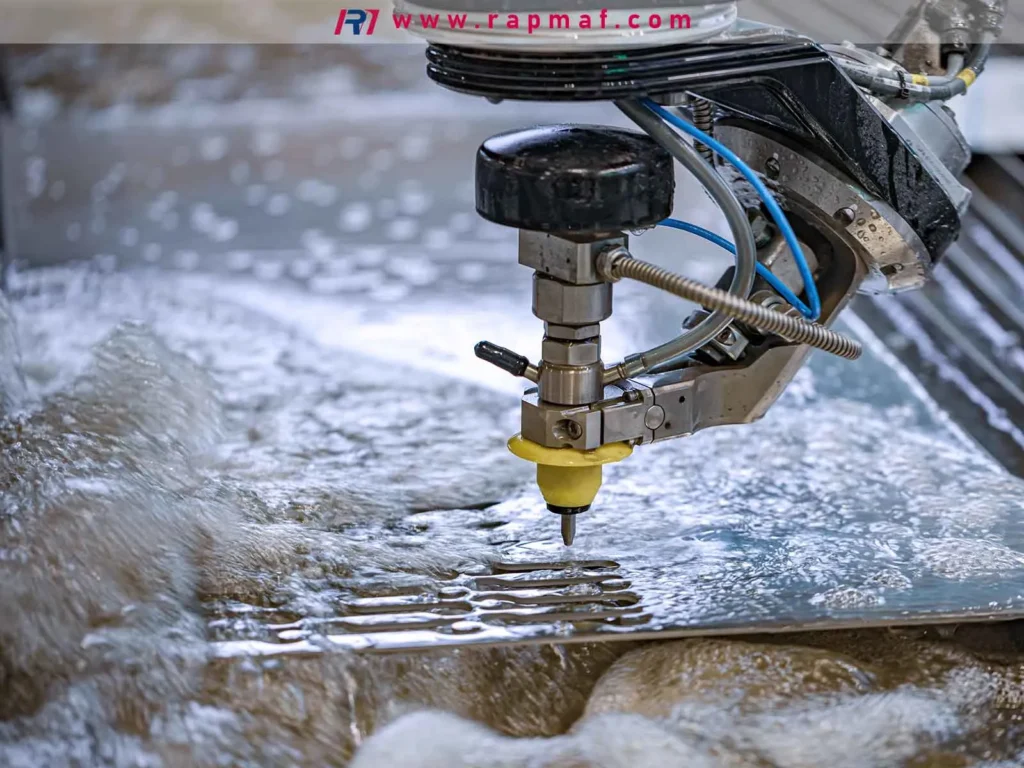 A close-up of a high-pressure abrasive waterjet head precisely cutting a metal plate, demonstrating the process where cutting speed directly impacts the final cost.