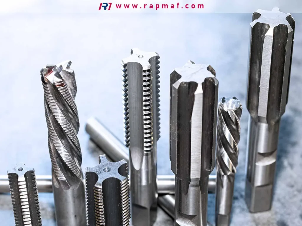 A collection of high-performance CNC cutting tools, such as end mills and taps, made from extremely hard and tough materials like tungsten carbide, which are required for machining other strong metals.