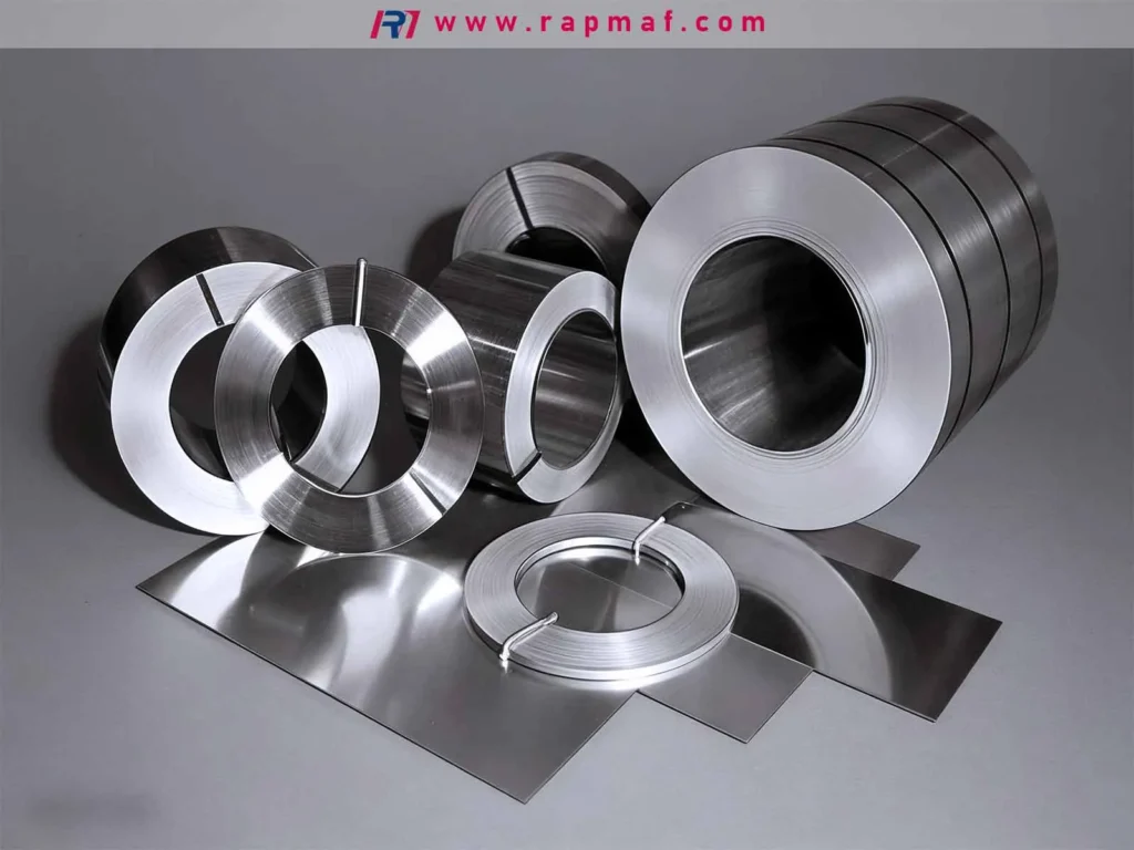 Rolls and sheets of stainless steel, a common raw material form that demonstrates the metal's ductility and strength, ready for fabrication and stamping processes.