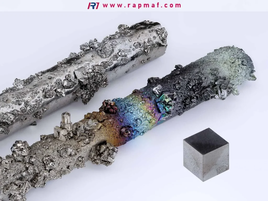 A comparison of exotic high-strength metals: two bars of crystallized metal (like osmium or iridium) and a dense, perfectly machined tungsten cube, showcasing some of the toughest and densest materials on earth.