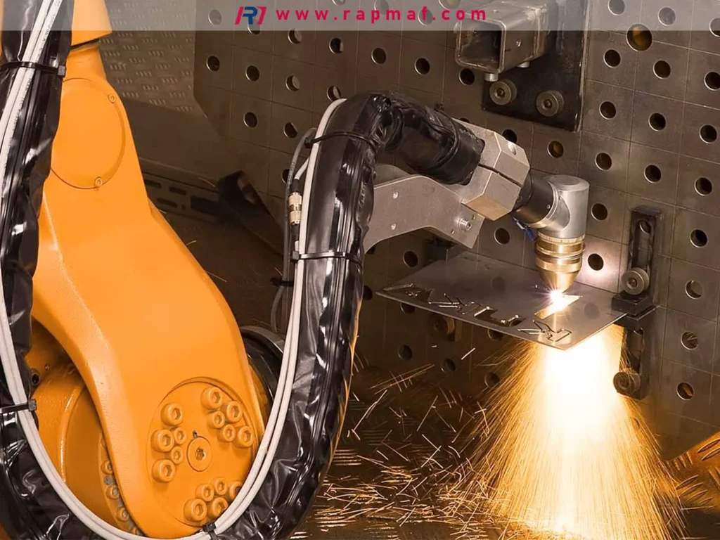 A high-precision robotic laser cutter, an advanced metalworking operation, using an intense laser beam to cut a complex shape from a sheet of metal with a shower of sparks.