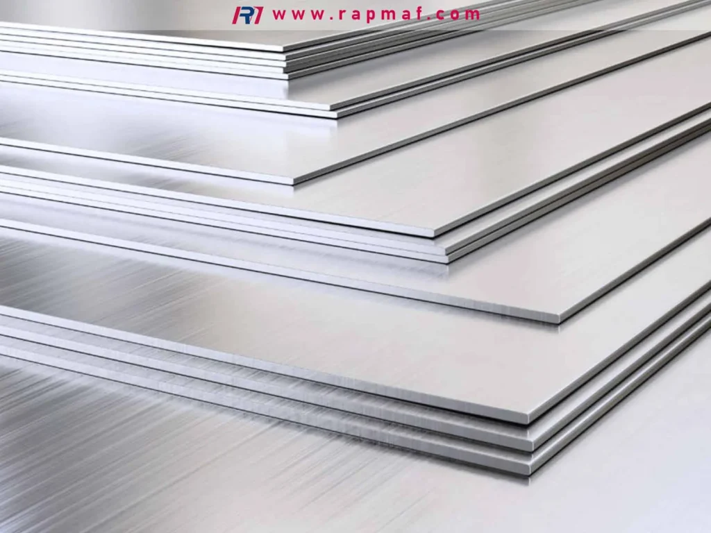 A stack of several high-quality, precision-cut aluminum sheets with a brushed finish, reflecting light on their clean surfaces. This image by Rapmaf provides a clear example of the sheet metal product discussed in the cost guide.