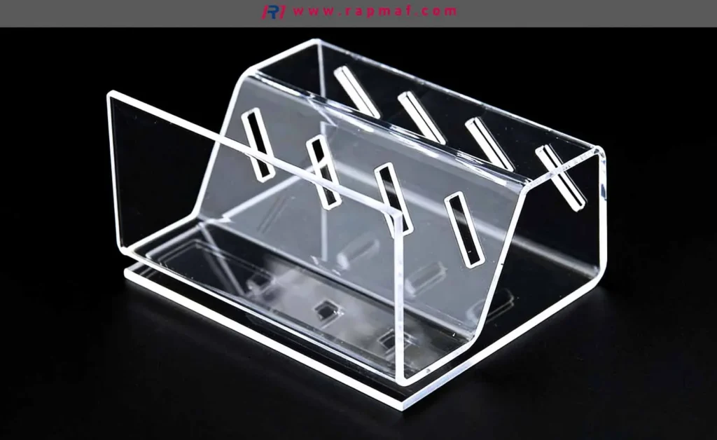 A custom-fabricated, transparent acrylic display holder, demonstrating the optical clarity achieved with precision laser cutting and heat bending of PMMA plastic for manufactured parts