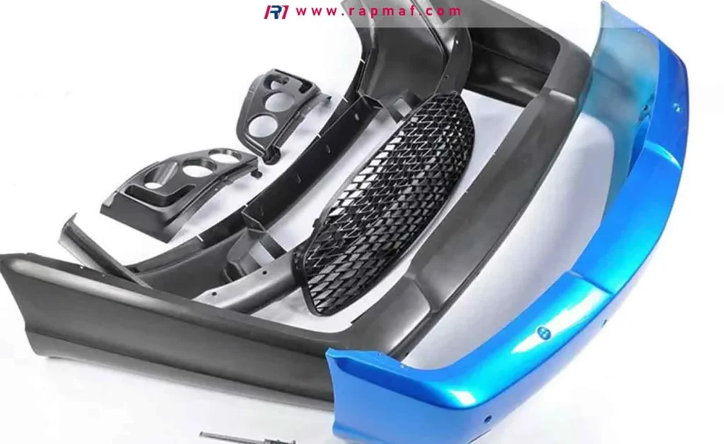 An assortment of automotive components manufactured by Rapmaf from Thermoplastic Polyolefin (TPO), including a blue car bumper, fascia, and interior trim pieces.
